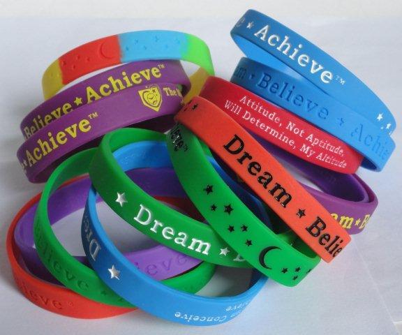 Dream-Believe-Achieve™ motivational wristbands with inspiring words and philosophies come in different colors including custom wristbands